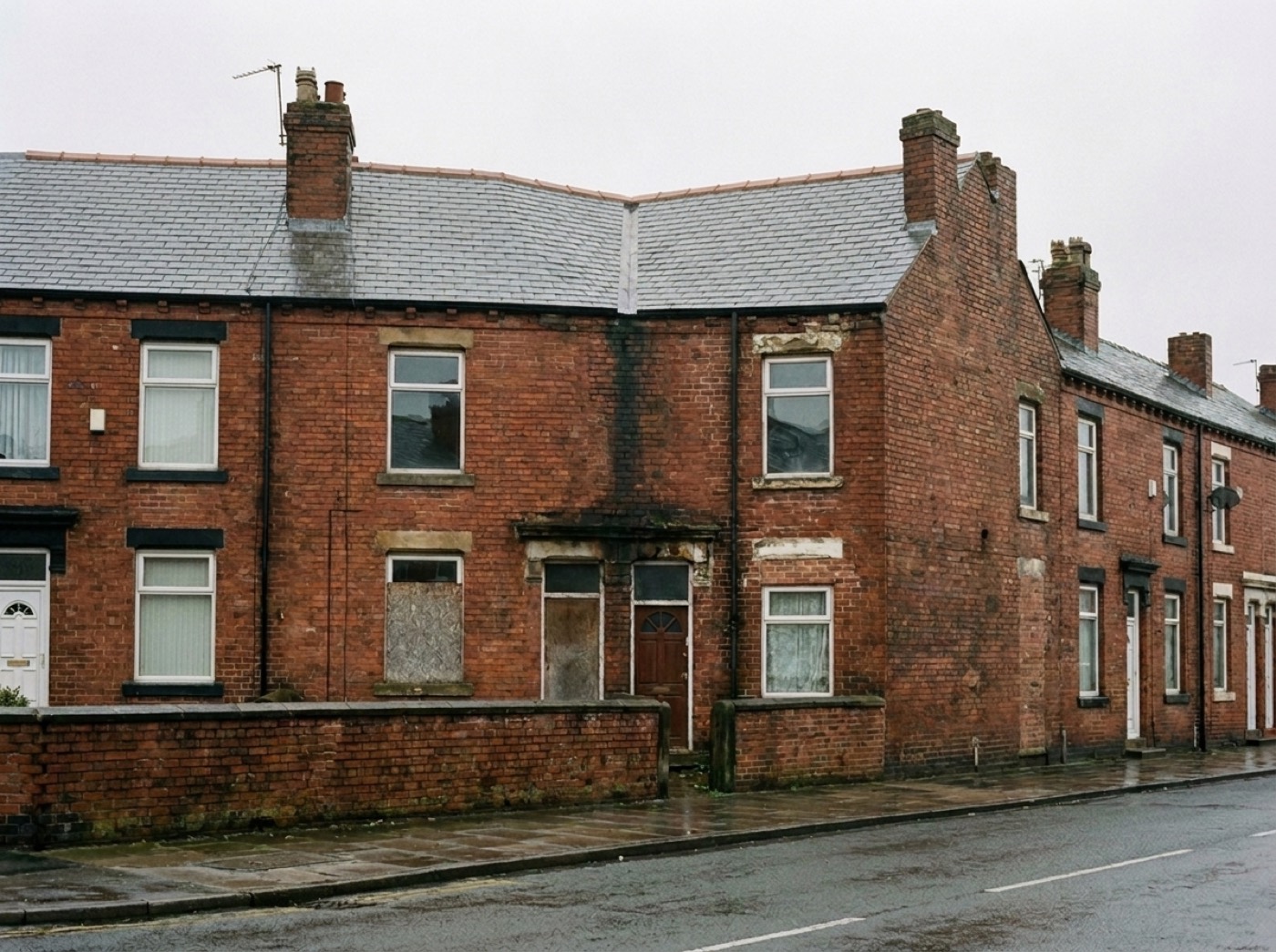 The same terrace from the same spot, re-roofed in even natural slate with a straight new ridge